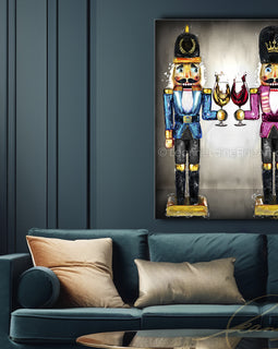 Living room with a blue sofa, Christmas tree, and framed artwork of nutcrackers. Nutcracker Sweet wine art from Leanne Laine Fine Art