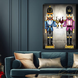 Living room with a blue sofa, Christmas tree, and framed artwork of nutcrackers. Nutcracker Sweet wine art from Leanne Laine Fine Art
