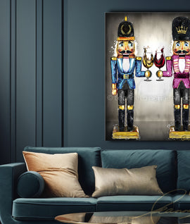 Living room with a blue sofa, Christmas tree, and framed artwork of nutcrackers. Nutcracker Sweet wine art from Leanne Laine Fine Art