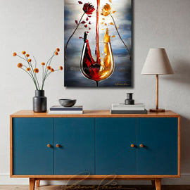 Blue cabinet with wooden top featuring am abstract wine art painting of a wine glass with red and yellow flower petals falling from flowers into the glass on a gray wall.