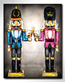 Two nutcrackers in pink and blue with whiskey bourbon glasses in hand against a neutral background