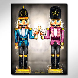 Two nutcrackers in pink and blue with whiskey bourbon glasses in hand against a neutral background