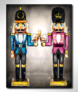 Two nutcrackers in pink and blue with whiskey bourbon glasses in hand against a neutral background